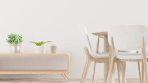 minimalist plants - Clean and modern dining area showcasing light wooden furniture and indoor plants.